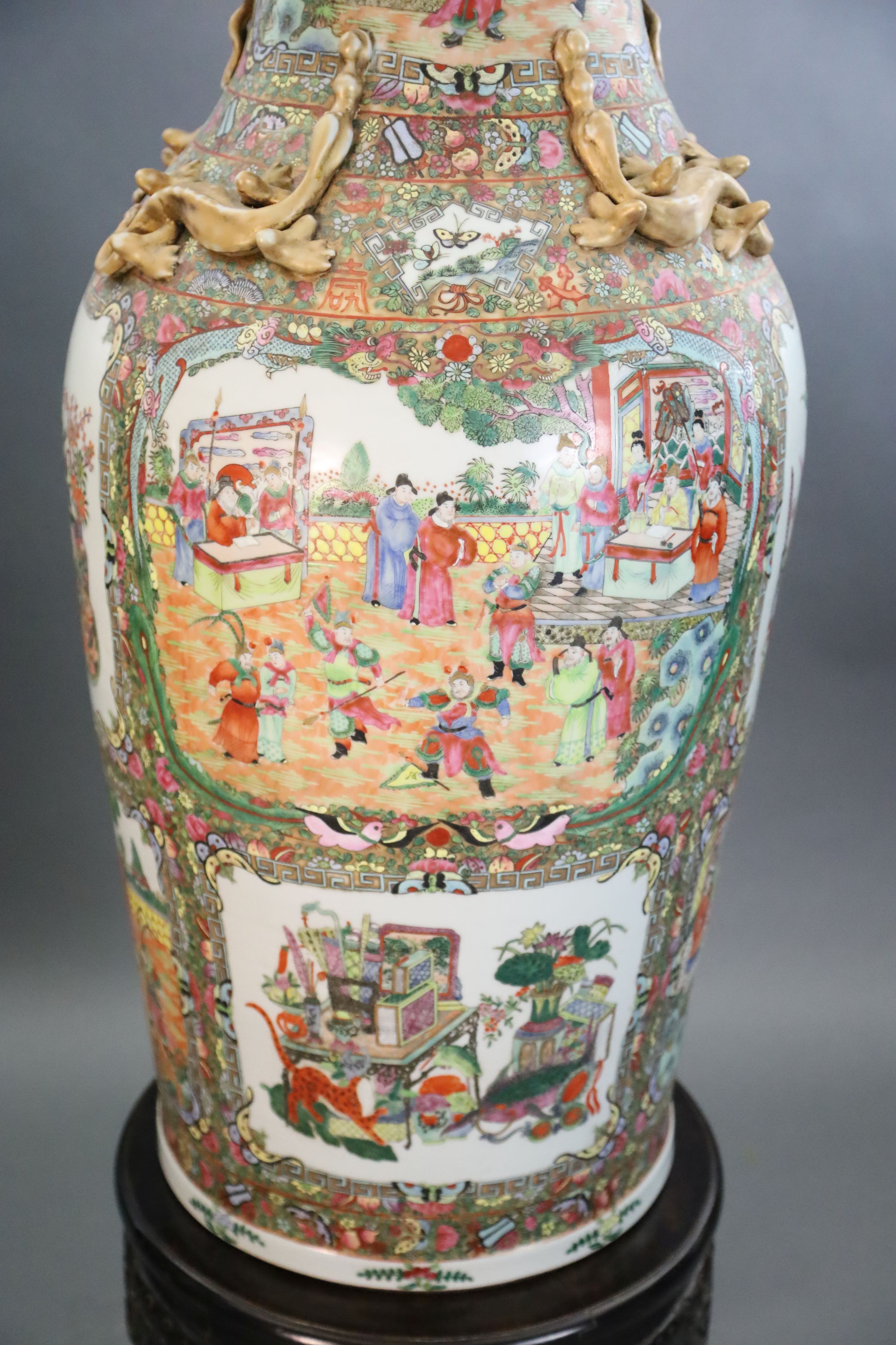 A pair of massive Chinese Canton style famille rose vases, 20th century and a pair of Chinese hongmu and marble stands, late 19th century